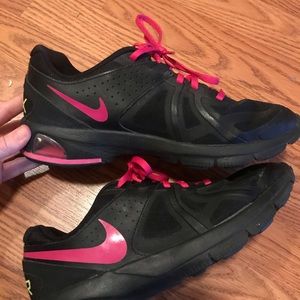 Black and hot pink nikes
